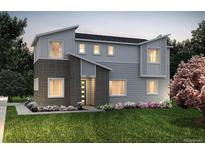 Charming two-story home with a modern design and manicured lawn at 23981 E 40Th Ave, Aurora, CO 80019