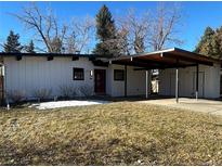 Charming single-story home featuring a carport, modern design, and a well-maintained lawn at 330 W Fair Ave, Littleton, CO 80120