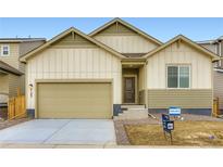 Charming single Gathering home featuring a two-car garage and neutral-toned exterior at 4102 Estrella St, Brighton, CO 80601