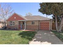 Charming single-story brick home with a well-maintained lawn and red accents at 3300 Oneida St, Denver, CO 80207