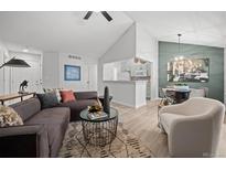 Inviting living room featuring modern furniture, an open layout and bright, neutral decor at 6755 S Field St # 625, Littleton, CO 80128