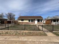 Charming single-story home with a cozy front yard, stone accents, and an inviting entrance at 10555 Montview Blvd, Aurora, CO 80010