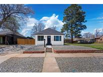 Charming home featuring a manicured, low-maintenance front yard with gravel landscaping and a freshly painted exterior at 4745 N Clay St, Denver, CO 80211