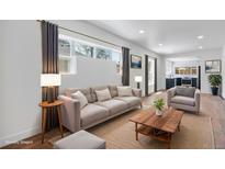 Bright living room features modern furnishings and decor at 4745 N Clay St, Denver, CO 80211