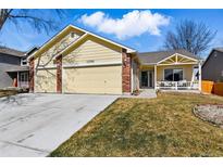 Charming single-Gathering home featuring a two-car garage, brick accents, and a welcoming front porch at 11386 Eaton Way, Westminster, CO 80020