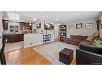 Open floor plan with updated kitchen and living area at 3343 Kearney St, Denver, CO 80207