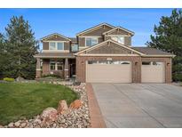 Beautiful two-story home with three-car garage and well-maintained lawn at 7624 Russell Ct, Arvada, CO 80007