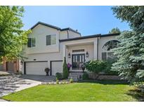 Beautiful two-story home with a well-manicured lawn and attached two car garage at 2062 Hyacinth Rd, Highlands Ranch, CO 80129
