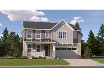 Charming two-story home boasts a blend of modern design and traditional architecture, showcasing stone accents and a welcoming front porch at 2185 S Gold Bug Ct, Aurora, CO 80018