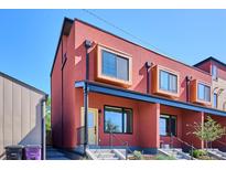 Modern townhome with a rust colored exterior and box style windows at 3943 W 12Th Ave, Denver, CO 80204