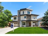 Modern two-story home with a well-manicured lawn and contemporary design elements at 2564 S Carey Way, Denver, CO 80222