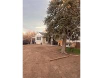 Ranch style home with large tree and spacious yard at 80 Xavier St, Denver, CO 80219