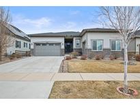 Charming single-story home featuring a two-car garage and stone accents at 26741 E Peakview Pl, Aurora, CO 80016