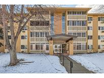 Apartment building with a tan exterior, decorative trim, and covered entrance, located at 1300 E Center Ave at 9300 E Center Ave # 3A, Denver, CO 80247