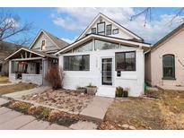 Charming single-story home featuring an entrance encased in expansive windows for an abundance of light at 1435 Lipan St, Denver, CO 80204