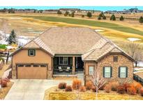 Inviting single-Gathering home boasts stone accents and a charming covered front porch at 27615 E Moraine Dr, Aurora, CO 80016