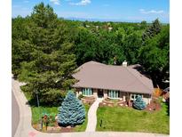 Beautiful home with mature trees and well-maintained landscaping at 10601 E Crestline Ave, Englewood, CO 80111