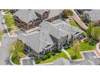 Stunning aerial view of modern townhomes with lush landscaping and accessible parking at 3751 W 136Th Ave # L1, Broomfield, CO 80023