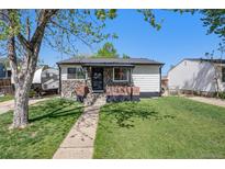 Charming single-story home with landscaped front yard and stone accents at 3685 S Hooker St, Englewood, CO 80110