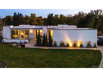 Stunning modern home features lush lawn, minimalist landscaping and stylish architectural details at 5969 S Humboldt Ct, Centennial, CO 80121