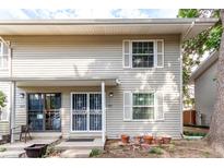 Charming two-story townhouse with a well-maintained exterior and lovely curb appeal at 1977 S Oakland Way, Aurora, CO 80014