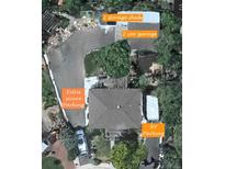 Aerial view of property showing extra secure parking, 2 car garage, RV parking and two storage sheds at 6361 S Spotswood Cir, Littleton, CO 80120