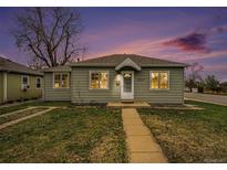 Charming home featuring a well-manicured lawn and inviting facade at dusk at 5100 Clay St, Denver, CO 80221
