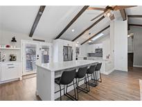 Bright open kitchen features a large island, modern appliances, and ample counter space at 9630 N Surrey Dr, Castle Rock, CO 80108