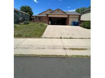 Two-story home with a two-car garage and covered porch at 2239 S Truckee St, Aurora, CO 80013