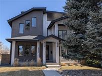 Stunning modern two-story home featuring mixed materials of gray brick and white siding with professional landscaping at 2540 Xavier St, Denver, CO 80212