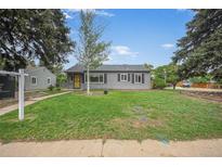 Charming gray home featuring a well-maintained front yard and a welcoming entrance at 1801 S Eudora St, Denver, CO 80222