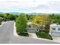 Charming two-story home with a well-manicured lawn and mature trees, offering curb appeal and a serene setting at 10911 Tennyson Ct, Westminster, CO 80031