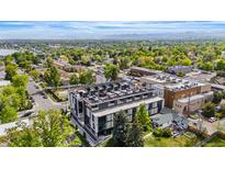 Modern building with rooftop terraces and views of lush surroundings and mountains in the background at 5125 W 29Th Ave # 5, Denver, CO 80212