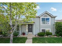 Charming two-story home featuring a well-maintained lawn and inviting front entrance, creating curb appeal at 68 N Quicksilver Ave, Castle Rock, CO 80104