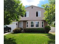 Charming two-story home with a well-manicured lawn and mature trees in a desirable neighborhood at 4837 S Pitkin Way, Aurora, CO 80015