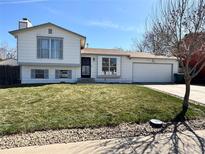 Charming two-story home featuring a well-maintained lawn and attached two car garage at 4416 E 93Rd Pl, Thornton, CO 80229