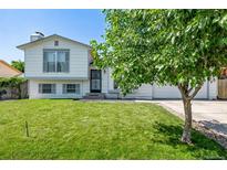 Charming two-story home with a lush green lawn and a well-maintained exterior at 4416 E 93Rd Pl, Thornton, CO 80229
