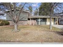 Charming single-Gathering home featuring stone accents and a well-manicured front yard at 1045 W 97Th Ave, Northglenn, CO 80260