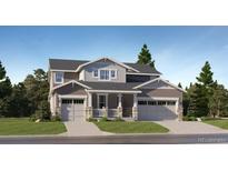 Charming two-story home featuring a front porch and a two-car garage at 641 Sunrise St, Erie, CO 80516
