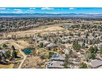 Stunning aerial view showcasing the neighborhood, open space, and mountain views at 32 Silver Fox Cir, Greenwood Village, CO 80121