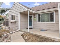 Charming home exterior featuring a covered front entrance and well-maintained landscaping at 1424 S Sierra Dr, Castle Rock, CO 80104