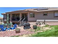 Inviting backyard featuring a patio area with outdoor furniture and a grill, perfect for entertaining at 10950 Elk Horn Run, Littleton, CO 80125