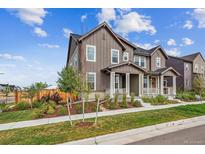 Beautiful two-story home featuring a covered porch and nicely landscaped front yard at 6105 N Hanover St, Denver, CO 80238