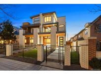 Modern home exterior features brick accents, balconies, and contemporary design elements at 553 Monroe St, Denver, CO 80206