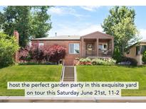 Charming brick home featuring a cozy front porch and beautifully landscaped front yard, perfect for outdoor enjoyment at 5044 W Moncrieff Pl, Denver, CO 80212