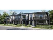 Modern townhome exterior featuring individual balconies and landscaped front yards at 8939 San Antonio St, Littleton, CO 80125