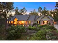 Charming home featuring a beautifully landscaped front yard and a covered front porch with stone accents at 315 Prospect Dr, Castle Rock, CO 80108