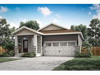 Craftsman style home with two-car garage and landscaped front yard at 18318 E 93Rd Pl, Commerce City, CO 80022