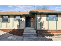 Inviting home entrance with visible house number, and well-maintained front yard landscaping at 4710 E Louisiana Ave, Denver, CO 80246
