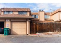 Attached garage and landscaped yard in front of this charming home at 1359 S Chambers Cir # C, Aurora, CO 80012